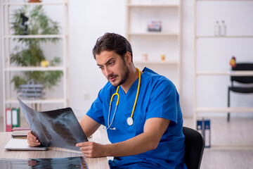 Young male doctor radiologist working in the clinic
