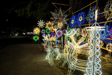 Outdoor Reindeer Christmas Decorations made with wire and LED wall strips. For sale with parols, and other decor at a stall.