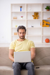 Young male student studying at home