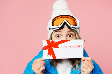 Snowboarder woman wear blue suit goggles mask hat ski padded jacket cover mouth with gift coupon...