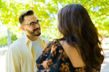 Romantic man looking at his beautiful girlfriend on a date