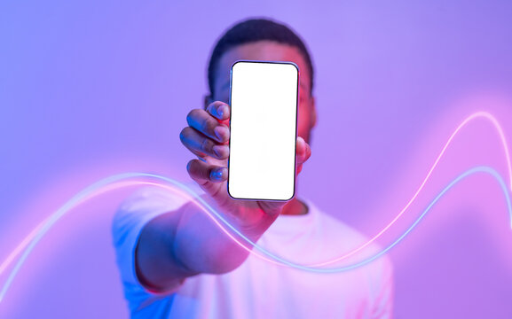 unrecognizable black guy hiding behind cell phone, mockup