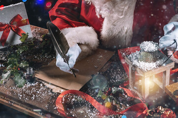 Santa claus writes a letter good wishes for Christmas gifts