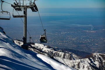 Obraz premium Almaty mountains. Shymbulak Ski Resort Hotel now-capped Tian Shan in Almaty city, Kazakhstan, Central Asia.