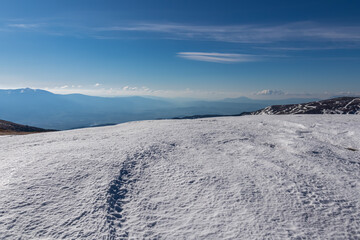 Scenic view of snow covered alpine meadows and Koralpe mountains seen from Ladinger Spitz, Saualpe,...