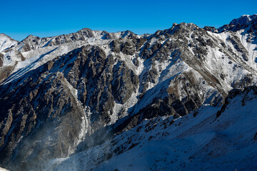Almaty mountains. Shymbulak Ski Resort Hotel now-capped Tian Shan in Almaty city, Kazakhstan, Central Asia.