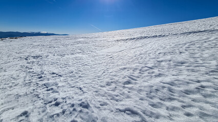 Scenic view of snow covered alpine meadows and Koralpe mountains seen from Ladinger Spitz, Saualpe,...