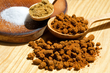 Asian spices. Dry adjika in a jar on the background of a towel and a wooden board.
