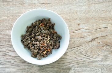 stir fried chop pork with Chinese black olive on bowl 