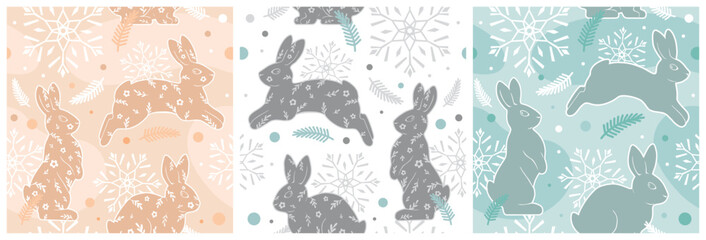 Set of cute winter festive seamless patterns of rabbits and snowflakes. Graphic vector illustration in trendy colors.