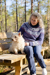 Woman with West Highland white terrier