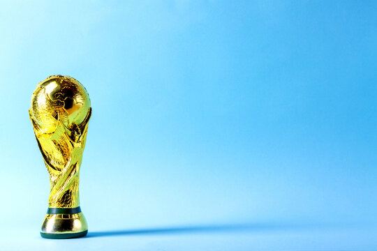 Moscow, Russia - November, 2022: FIFA World Cup Trophy against blue background.