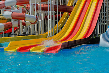 Water park for adults and children with water slides and pools for entertainment and outdoor activities.