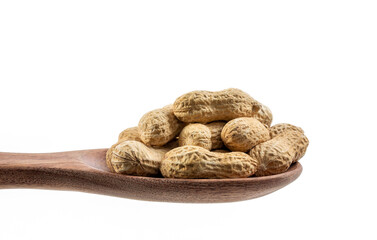 Organic peanuts in shell on wooden spoon on white background.