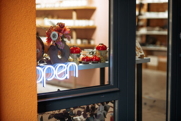 A business light sign Open hang on ceramic handicraft shop door at entrance