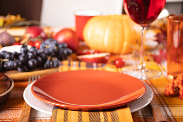 Autumn place setting dinner for celebration Thanksgiving Day. Holiday party. Festive table. Snacks, friuts,pie, pumpkin, vegetables, wine glasses.