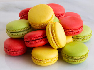 Cake macaron or macaroon on marble background, colorful almond cookies, bright colors, vintage card, screensaver for phone