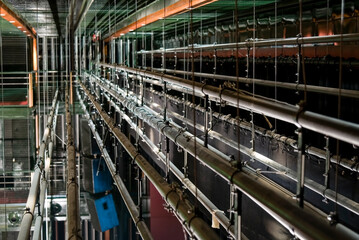 The symmetry, hardness, abstraction and geometry of the backstage of a show house, with its tubes,...