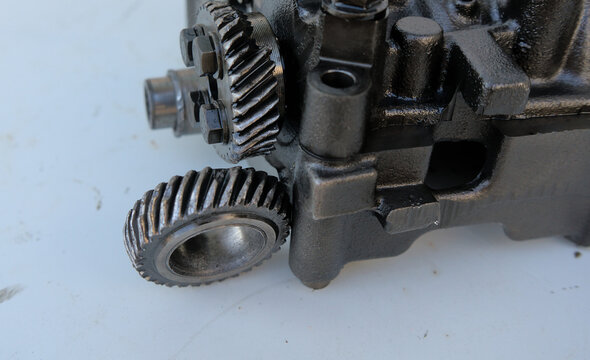 Broken gear on the balancer shafts and oil pump drive in a car engine
