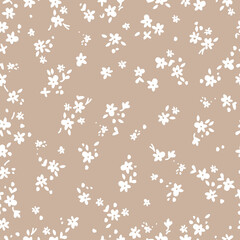 Cute floral pattern. Seamless vector texture. An elegant template for fashionable prints. Print with small white flowers and  leaves. beige  background.