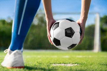 football player set ball football on grass at freekick point before shoot or kick to win a score in international league football match