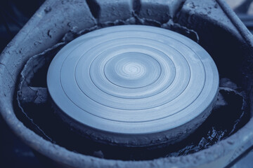 Fototapeta na wymiar Potter's wheel with a lump of clay on it