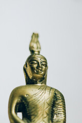 Statuette of blessing Buddha isolated over the white background