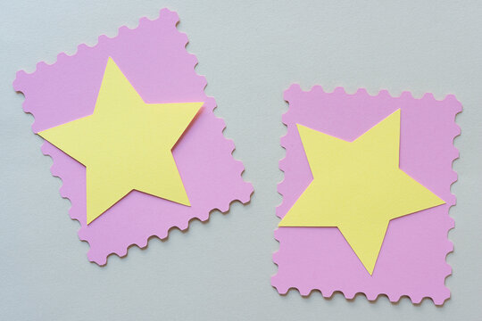 yellow paper stars on pink frame with fancy borders