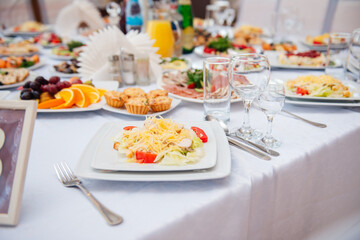 beautifully set table at a wedding banquet with delicious food and alcohol	
