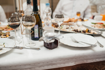 beautifully set table at a wedding banquet with delicious food and alcohol	
