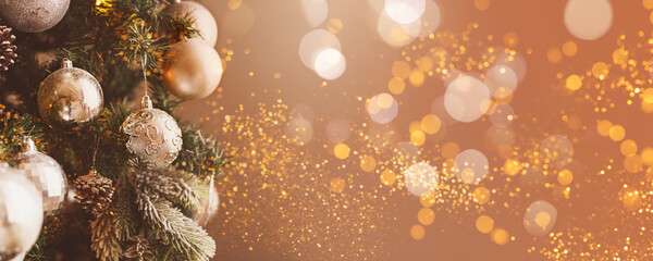 Silver Christmas balls on a fir tree. The image is in soft focus.