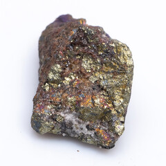 Natural stone chalcopyrite on a white background. Mineral of golden color on a white background
