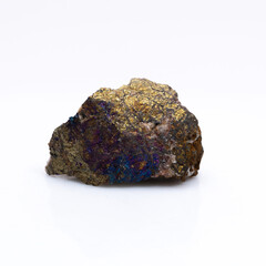 Natural stone chalcopyrite on a white background. Mineral of golden color on a white background