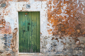 Best years are gone - Old damaged facade with weathered door - 4867