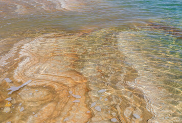 Mud and layers of salt on the coast of the Dead Sea in Israel