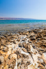 Mud and layers of salt on the coast of the Dead Sea in Israel