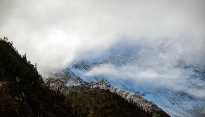 Peaks of mountains covered with clouds