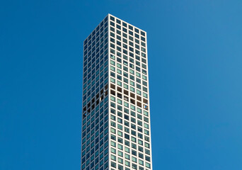 Modern city building architecture apartments. Low angle view of skyscrapers. Looking up perspective. Bottom view of modern skyscrapers in a business district. Cityscape at daylight.