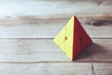 Triangle Puzzle Cube on wooden table