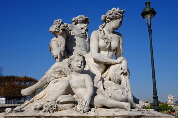 Beautiful shot of the La Seine et la Marne statue in Tuileries Gardens, Paris