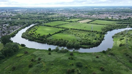 Aerial shot of the River Mersey in Warrington, Cheshire with Paddington Meadows behind