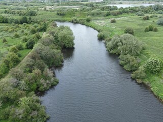Fototapeta na wymiar Aerial shot of the River Mersey in Warrington with Woolston Eyes wetland in the background