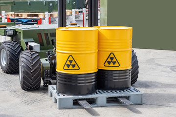 Barrels with radioactive products. Unmanned forklift. Machine for working in radioactive zone. Forklift for transportation of hazardous substances. Robot carries barrels of radioactive material - obrazy, fototapety, plakaty
