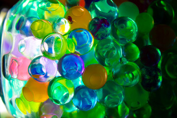 Colored balls in a glass with bokeh effect