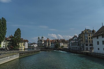 View of Reuss river surrounded by beautiful architecture of Lucerne, Switzerland