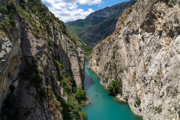 Turquoise river Sulak meandering through rocky forested landscape. Gorge of the mountain river
