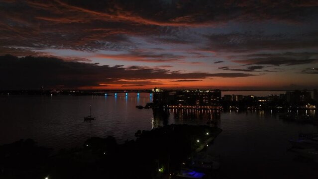 Sarasota Blue hour over Bayfront Marina toward Ringling Bridge into orange sunset.