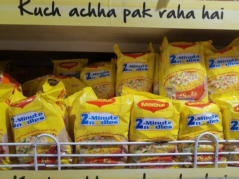 various flavor of meggi display in supermarket shelf