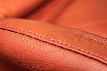 Red leather seat stitching - obrazy, fototapety, plakaty