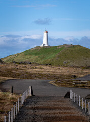 Reykjanes lighthouse on top of hill seen from Gunnuhver hot springs area at Reykjanes peninsula,...